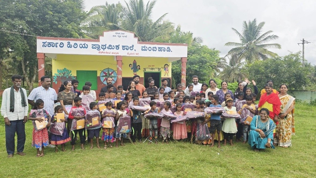 Children and community at a school distribution event